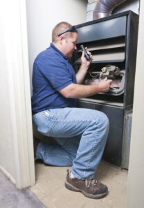 technician-repairing-furnace