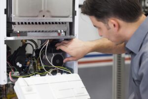 technician-working-on-heating-system